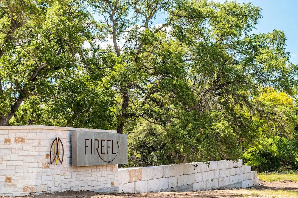 Firefly Resort entryway and sign in Fredericksburg Texas