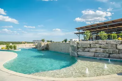 outdoor swimming pool and splash pad at Firefly Resort in Fredericksburg